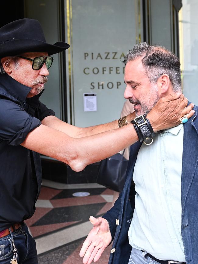 Mr O‘Keefe is embraced by a Sydney local as he leaves Downing Centre court. Picture: NCA NewsWire / Jeremy Piper