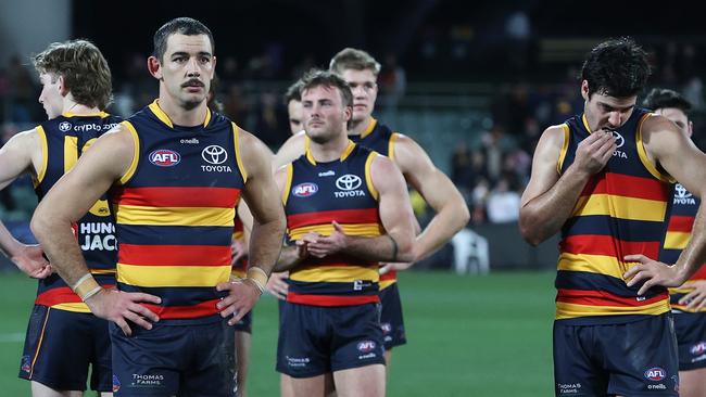 ADELAIDE, AUSTRALIA – JULY 15: Crows players after the loss during the 2023 AFL Round 18 match between the Crows and the GWS Giants at Oval on July 15, 2023 in, Australia. (Photo by Sarah Reed/AFL Photos via Getty Images)