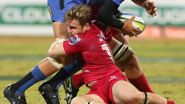 PERTH, AUSTRALIA - JULY 05: Sam Wykes of the Force gets tackled by Rob Simmons and Ben Lucas of the Reds during the round 18 Super Rugby match between the Western Force and the Queensland Reds at nib Stadium on July 5, 2014 in Perth, Australia. (Photo by Paul Kane/Getty Images)