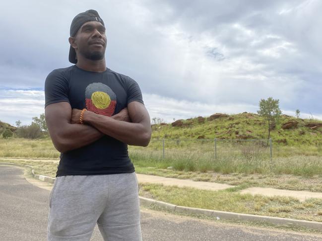 Jamie Fejo stands outside a house at the Ilpeye Ilpeye town camp on the edge of Alice Springs. Picture: Matt Cunningham