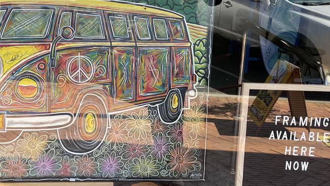 A Phillip Burton artwork displayed in a Taree shopfront on the day of the guilty verdict. It was removed soon after.