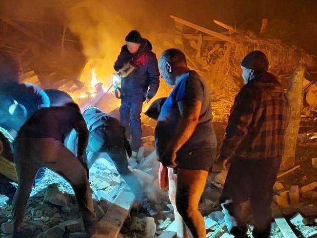 Rescuers deal with a Russian air strike which destroyed private houses in Zhytomyr. Picture: AFP/Ukraine Emergency Ministry press service