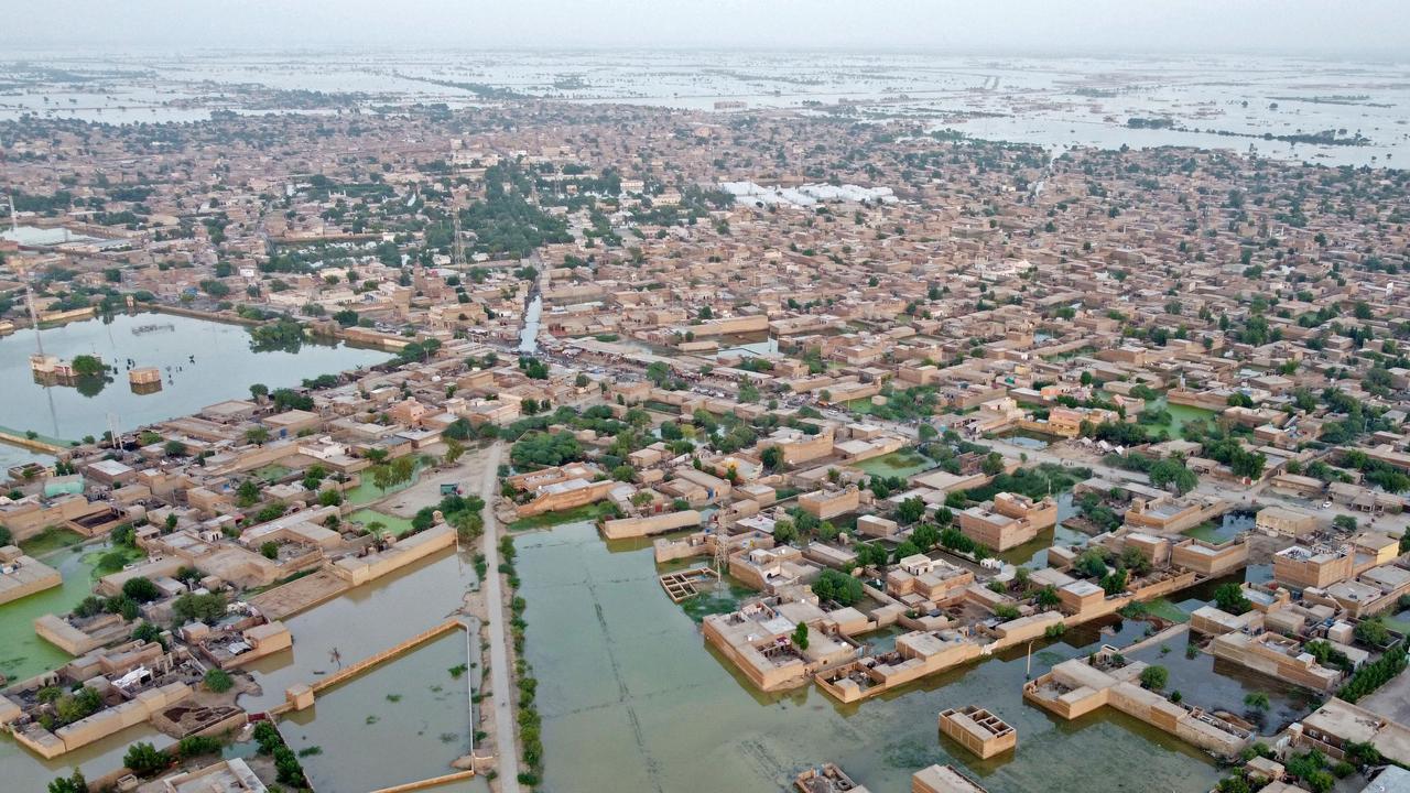 This aerial photograph taken on September 5, 2022 shows flooded residential areas after heavy monsoon rains in Dera Allah Yar, Balochistan province. – Nearly a third of Pakistan is under water — an area the size of the United Kingdom — following months of record monsoon rains that have killed 1,300 people and washed away homes, businesses, roads and bridges. (Photo by Fida HUSSAIN / AFP)