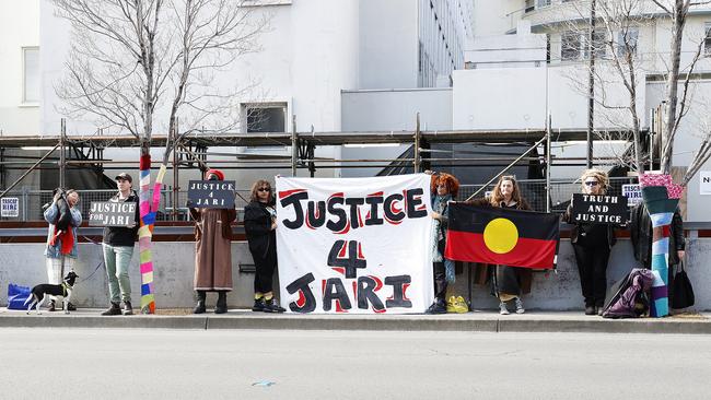 Family and friends of Jari Wise stand out the front of Hobart Magistrates Court as his former girlfriend Melissa Oates attended court to enter a plea which was later adjourned. Picture: Zak Simmonds