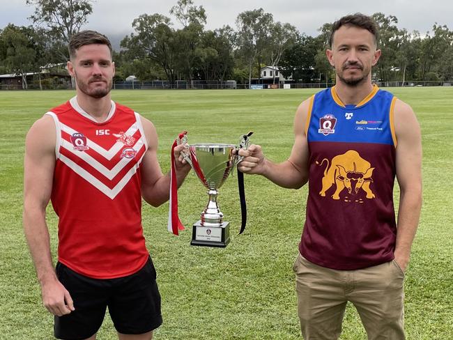 Yeppoon vice-captain Leigh Cossens (left) and Glenmore co-captain/coach Tim Higgins with the prized premiership trophy, which will be presented to the grand final winner on Saturday.