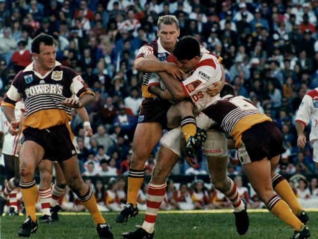 Trevor Gillmeister and Allan Langer tackle Scott Gourley in th 1993 decider.