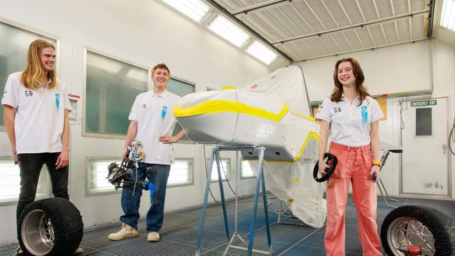 Engineers from the UTS: Motor Sports Electric FSAW Team, Andrew Weihen, Broughton Caley, and Liv Heaton, with their car which will be revealed at SXSW. Picture: Justin Lloyd/The Daily Telegraph.
