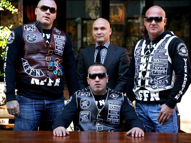 Nomads President Sleiman 'Simon’ Tajjour (seated) took the ‘Consorting Laws’ to the High Court of Australia. He is pictured with fellow gang members and lawyer Simon Joyner (rear, centre).