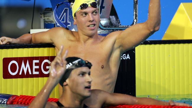 Craig Stevens (rear) celebrates winning a bronze medal in the 800m freestyle at the World Championships in 2008. Gold winner Oussama Mellouli (front) was later forced to return his medal following a positive drugs test.