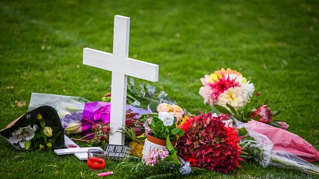 Tributes for Birdwood football player Antonio Loiacono 20, who died in hospital after suffering critical injuries during a match between Birdwood Football Club and Gumeracha. The cross with flowers and a candle was placed inside the centre square on Gumeracha Oval. Picture: NCA NewsWire / Naomi Jellicoe