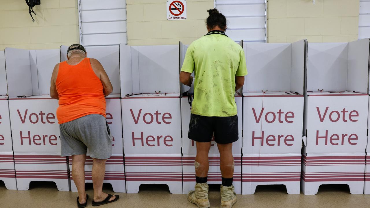 Voters mark their ballot paper and cast their vote at the polling booth at the Down Park Community Centre, Edmonton. Picture: Brendan Radke