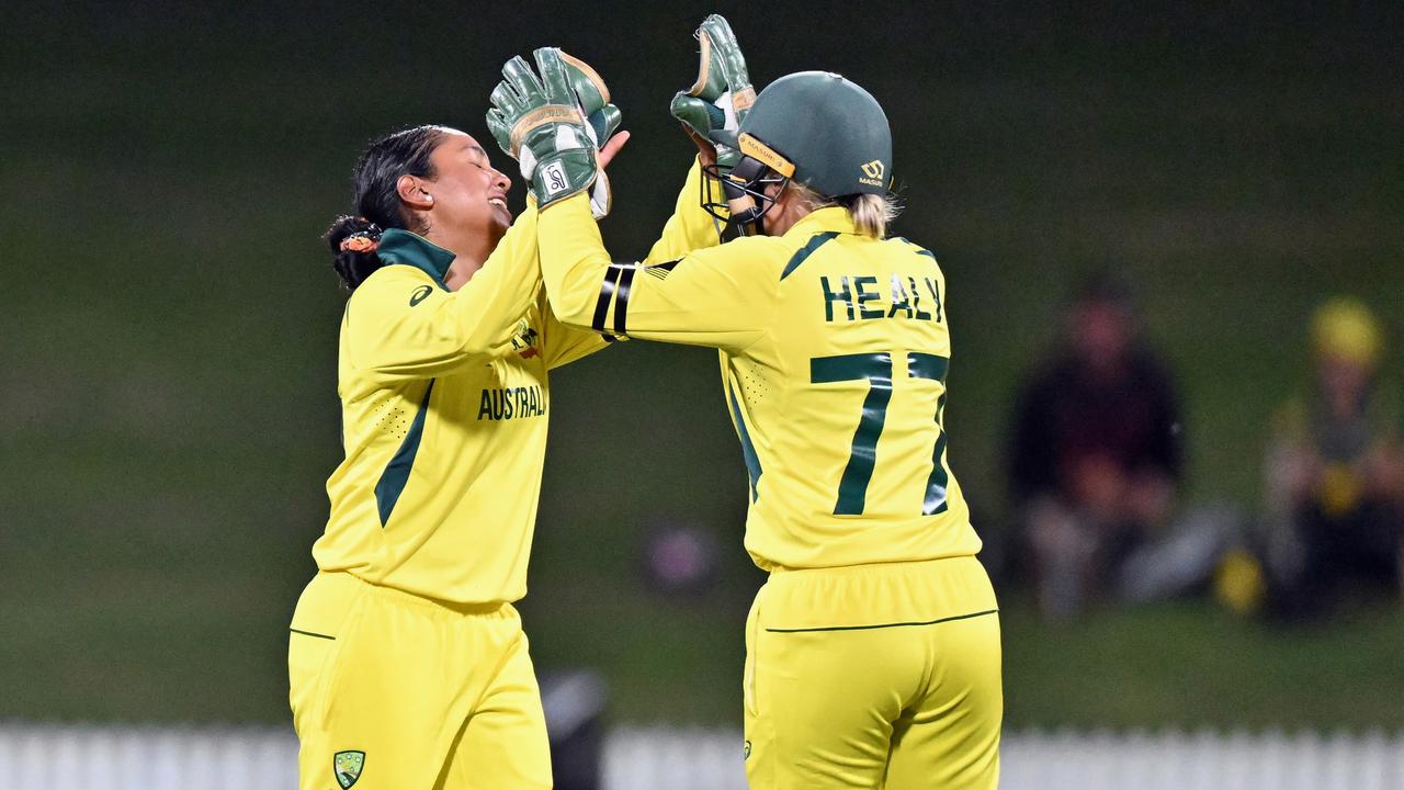 Alana King and Alyssa Healy celebrate a wicket against England.