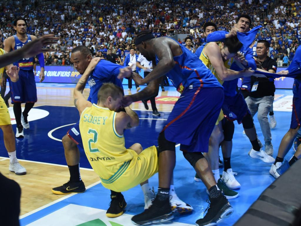 Players from benches run to their teammates who figured in a brawl during the match between Australia and the Philippines for the FIBA Asian Qualifiers held at the Philippine Arena in the province of Bulacan, north of Manila in 02 July 2018. Australia beat the Philippines by default following a brawl in the third quarter that shocked basketball fans all over the world. (Photo by George Calvelo/NurPhoto via Getty Images)