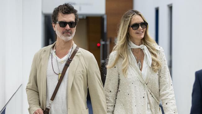 Elle Macpherson and her partner Doyle Bramhall arrive in Sydney before her appearance at the Australian Open. Picture: Julian Andrews