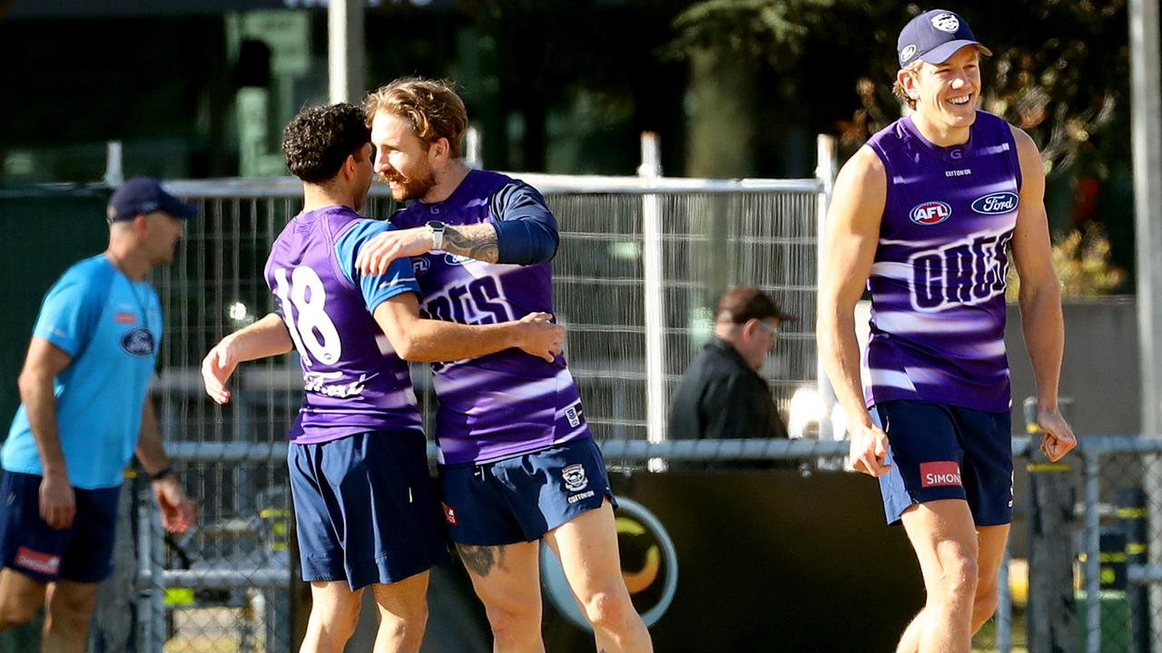 Tyson Stengle back on the training ground gets a hug from Zach TuohyPicture: Alison Wynd