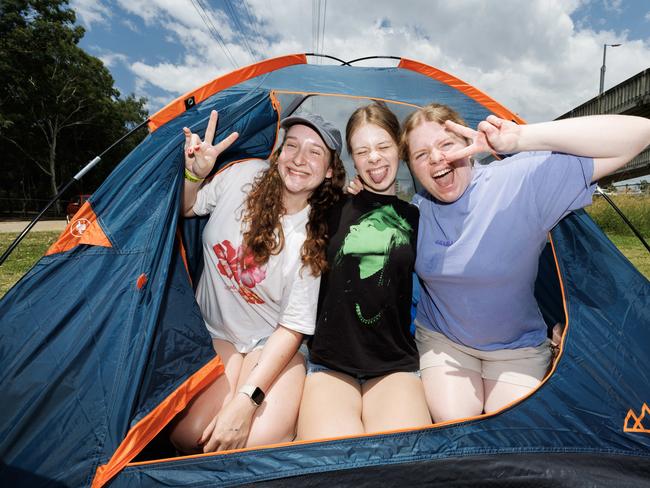 Amy Sheehan, 19, Nadia Van Wegen, 19, and Amy Clarke, 18, camping out at Boondall ahead of Billie Eilish’s run of shows. Picture: Lachie Millard