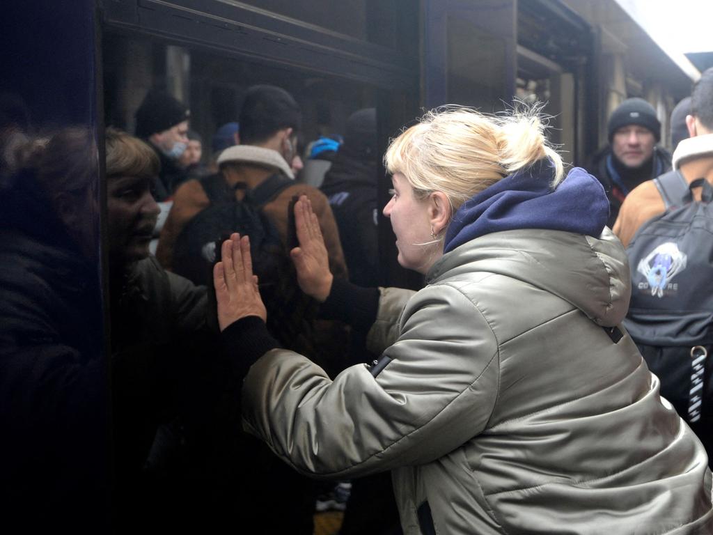 A woman says goodbye as a train with evacuees leaves Kyiv's railway station. Picture: AFP