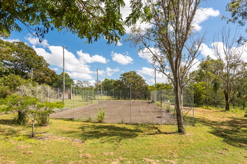 This Raglan Heritage School, built in 1879, and a three-bedroom, high set home are for sale. 