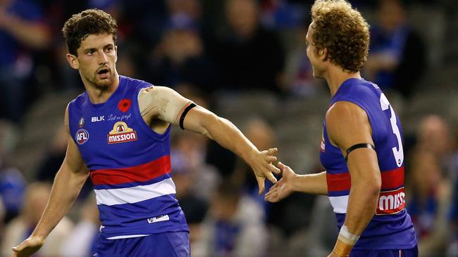 Tom Liberatore celebrates a goal with Mitch Wallis.