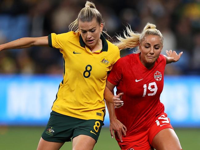 SYDNEY, AUSTRALIA - SEPTEMBER 06: Charlotte Grant of the Matildas and Adriana Leon of Canada compete for the ball during the International Friendly Match between the Australia Matildas and Canada at Allianz Stadium on September 06, 2022 in Sydney, Australia. (Photo by Mark Kolbe/Getty Images)