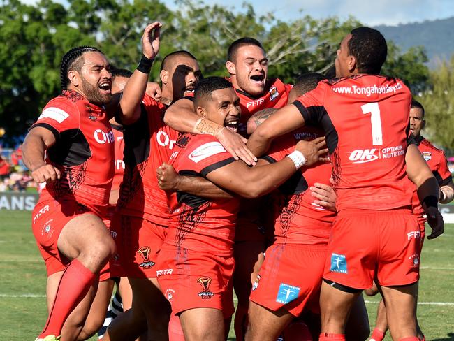 The Tongans celebrate Michael Jennings try against Scotland during the World Cup Rugby League game at the Cairns Barlow Park in Cairns, Sunday, October 29, 2017. (AAP Image/Brian Cassey) NO ARCHIVING, EDITORIAL USE ONLY