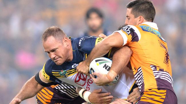 Matt Scott of the Cowboys is stopped in his tracks. Picture: Bradley Kanaris/Getty Images