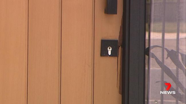 Damage to the front door of the incorrect home. Picture: 7 NEWS