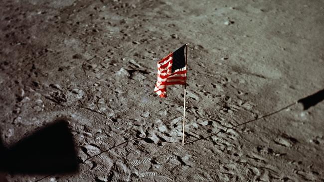 An American flag on the surface of the moon, placed by the Apollo 11 astronauts. Picture: Getty Images