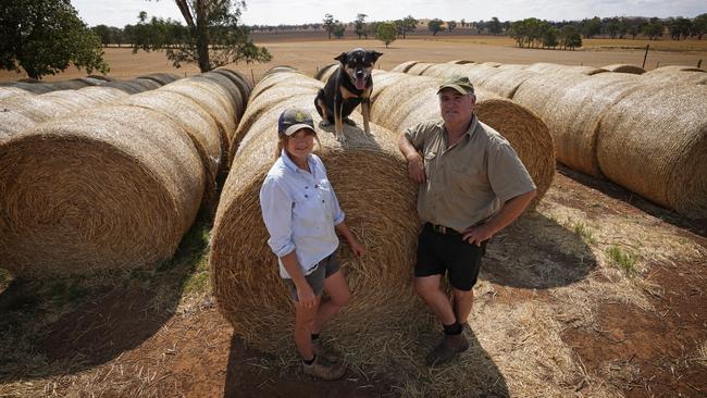 John and Jenny Hogan, on their property near Bethungra, are worried supplies of hay soon run out. Picture: Brad Newman