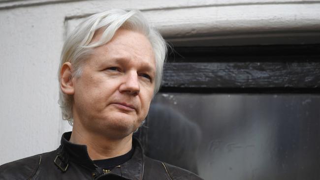 (FILES) In this file photo taken on May 19, 2017 Wikileaks founder Julian Assange speaks on the balcony of the Embassy of Ecuador in London. - WikiLeaks founder Julian Assange, who was behind a massive dump of classified US documents in 2010, has been charged in the United States, WikiLeaks said on November 15, 2018. (Photo by Justin TALLIS / AFP)