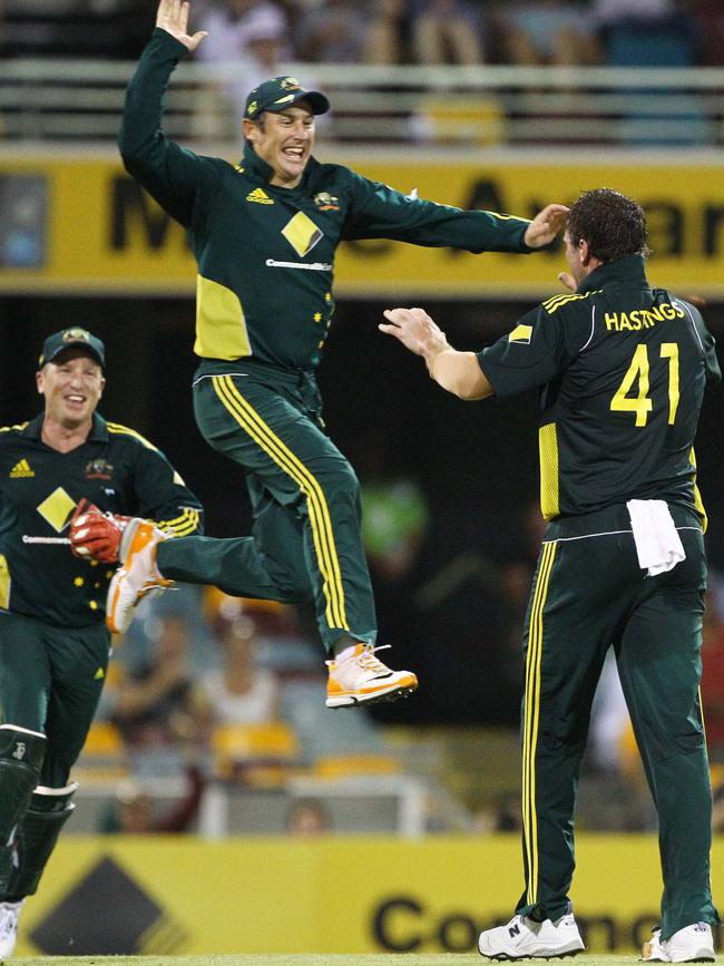 John Hastings (right) and David Hussey celebrate the wicket of Ian Bell in 2011.