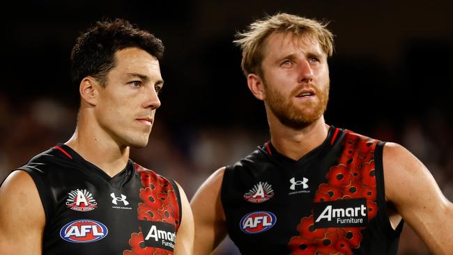 MELBOURNE, AUSTRALIA - APRIL 25: Dylan Shiel (left) and Dyson Heppell of the Bombers look dejected after a loss during the 2023 AFL Round 06 match between the Collingwood Magpies and the Essendon Bombers at the Melbourne Cricket Ground on April 25, 2023 in Melbourne, Australia. (Photo by Michael Willson/AFL Photos via Getty Images)