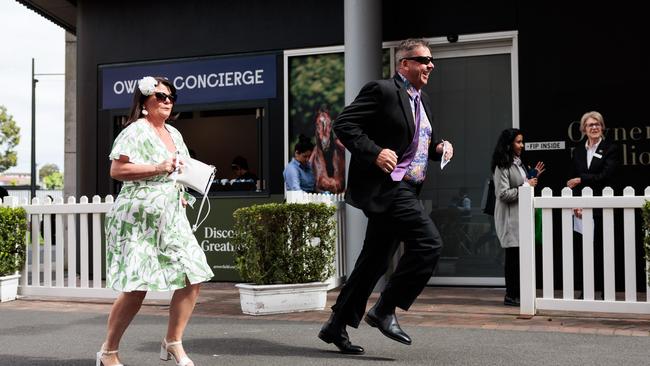 And they’re off.... racegoers rush to the course. Picture: Chris Huang / Matrix