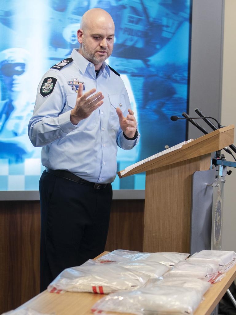 Australian Federal Police Sgt. Nick Gibson with $5.5m of meth and cocaine seized at the Hobart Airport on Monday 27th March 2023. Picture: Chris Kidd