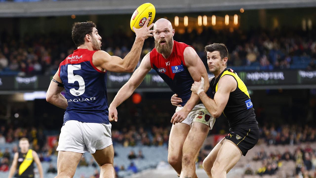 MELBOURNE, AUSTRALIA - JULY 30: Christian Petracca of the Demons contests the ball as Max Gawn of the Demons shepherds Trent Cotchin of the Tigers during the round 20 AFL match between Richmond Tigers and Melbourne Demons at Melbourne Cricket Ground, on July 30, 2023, in Melbourne, Australia. (Photo by Daniel Pockett/Getty Images)