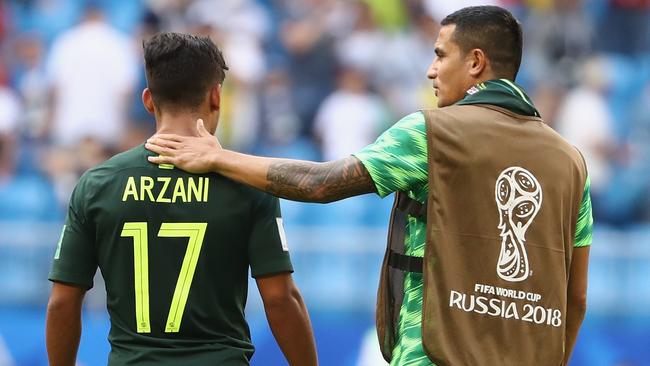Daniel Arzani and Tim Cahill embrace during Australia’s clash with Denmark. Picture: Getty Images