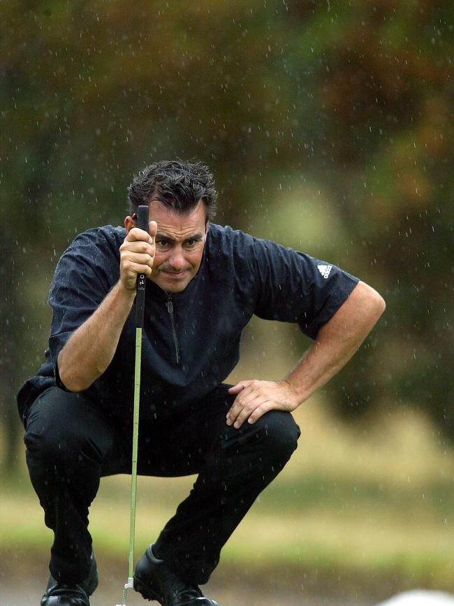 Mark Allen lines up a putt.