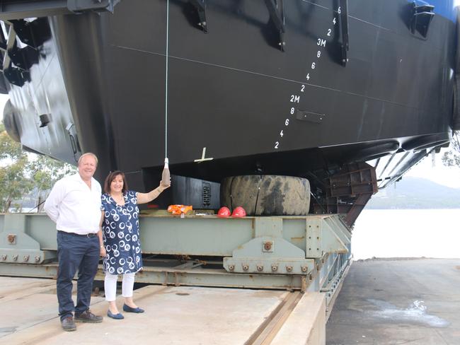 Peter and Frances Bender at the naming and launch of Huon Aquaculture’s fully automated feed barge Hogan.