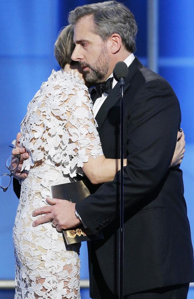 Wiig and Carell console each other after sharing their depressing childhood stories at the Golden Globes.