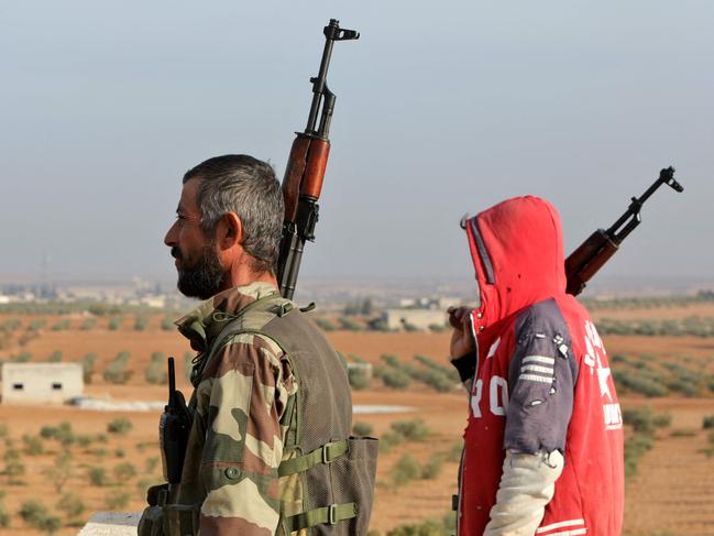 Turkey-backed Syrian fighters stand guard in Jarabulus close to the border with Turkey in the rebel-held north of Syria's Aleppo province, on November 21, 2022. Picture: Bakr Alkasem / AFP