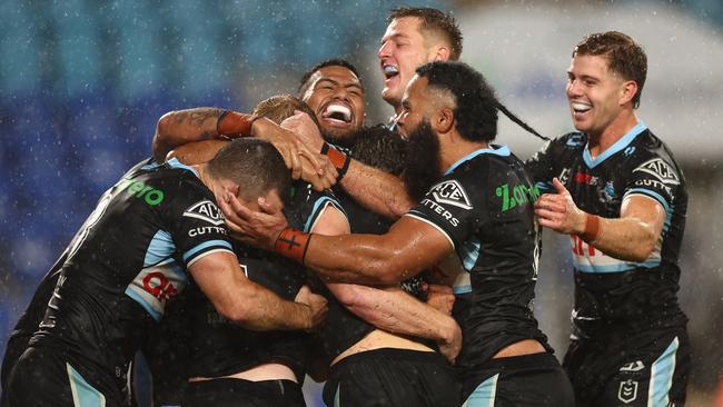 Lachie Miller celebrates a try on debut (Photo by Chris Hyde/Getty Images)