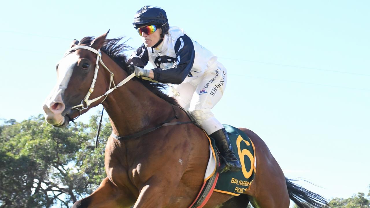 Gossitino ridden by Melinda McDonald wins the Remembering the ANZACs Maiden Plate at Balnarring Racecourse on April 16, 2022 in Balnarring, Australia. (Ross Holburt/Racing Photos)