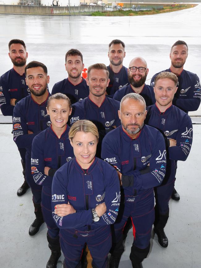 Pacific Airshow Gold Coast 2024 Media Day at Gold Coast Airport. Flight Lieutenant Jennifer Littler in front of the rest of her RAF Falcons Skydiving team. Picture Glenn Hampson