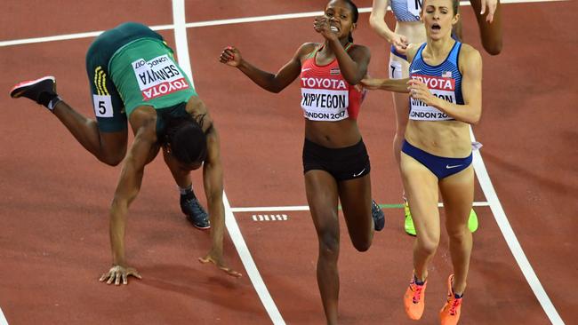 South Africa's Caster Semenya (left) falls as she crosses the line in the bronze medal position in the women’s 1500m final at the World Athletics Championships in London. Photo: AFP