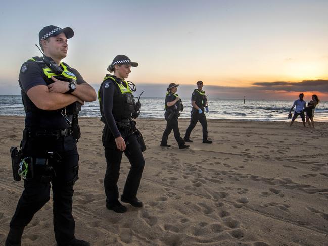 Police patrolling St Kilda beach on New Years eve. Picture: David Geraghty