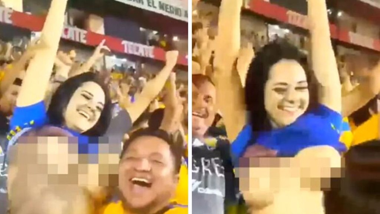 Fan flashes boobs in 'wildest celebration ever' and poses for