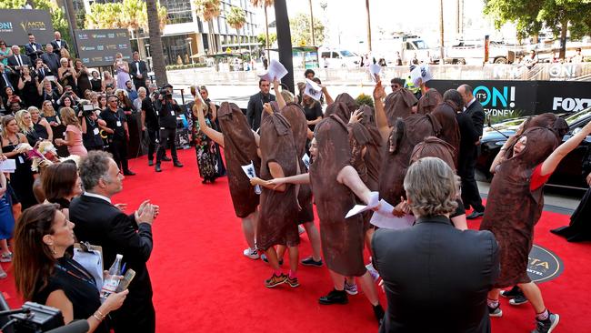 The protesters dressed in sausages, stormed onto the red carpet. Picture: Richard Dobson