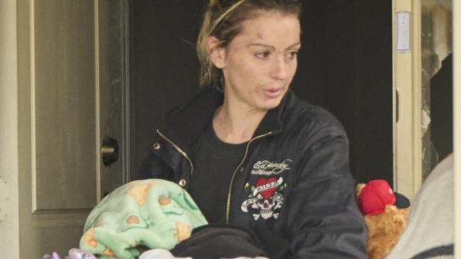 Anastasia Marshall leaving the home she shared with Krystal Marshall in Aldinga Beach, after she was found dead on October 22. Picture: Matt Loxton