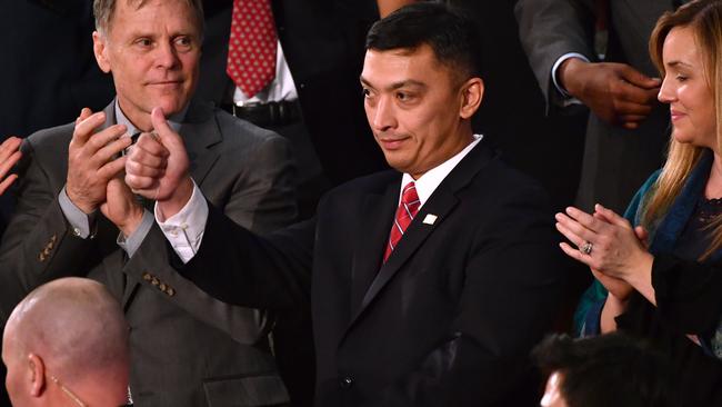 US Immigration and Customs Enforcement agent CJ Martinez is recognised by President Trump. Picture: AFP