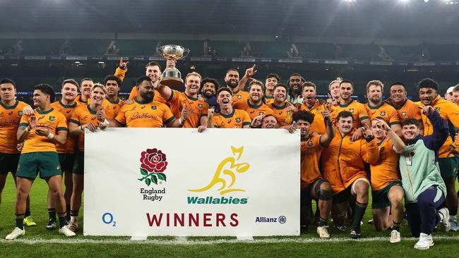 The Wallabies celebrate with the Ella Mobbs Cup after their victory over England. Picture: David Rogers/Getty Images